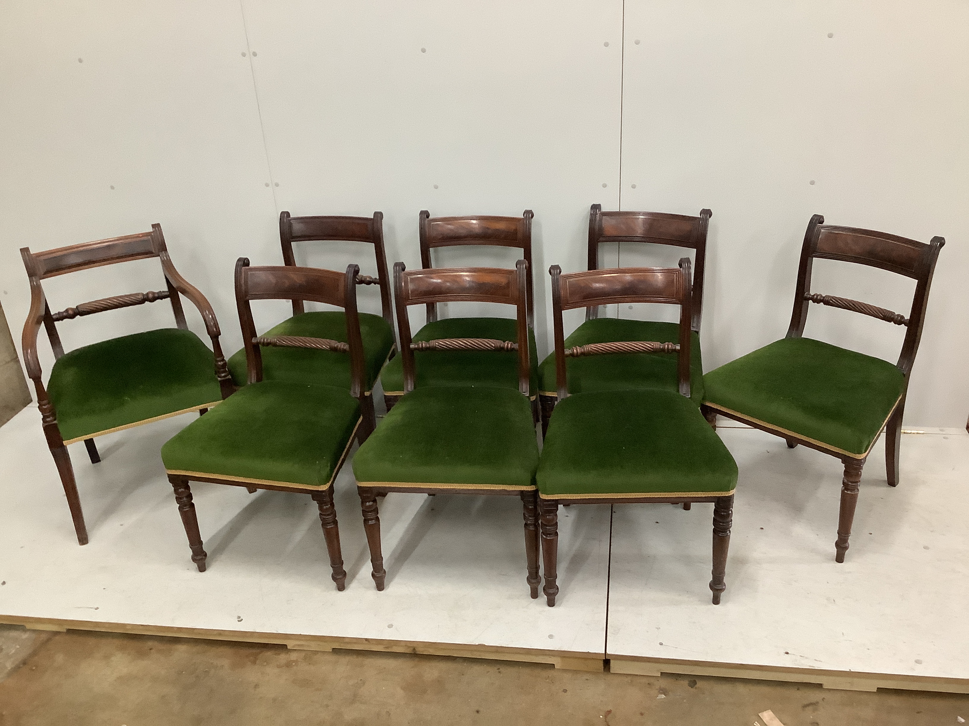 A harlequin set of eight Regency mahogany dining chairs, one with arms